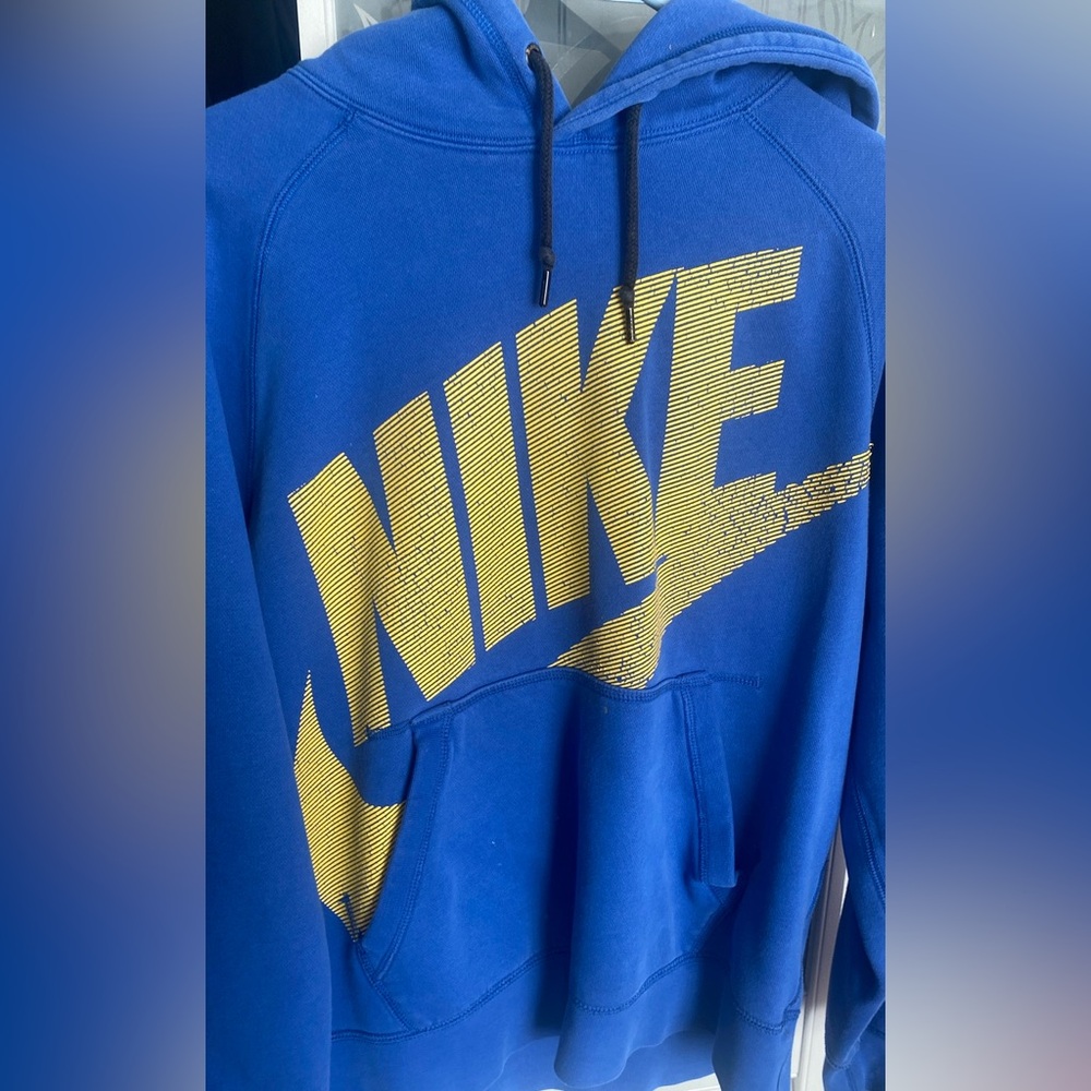 Electric blue Nike hoodie with yellow print